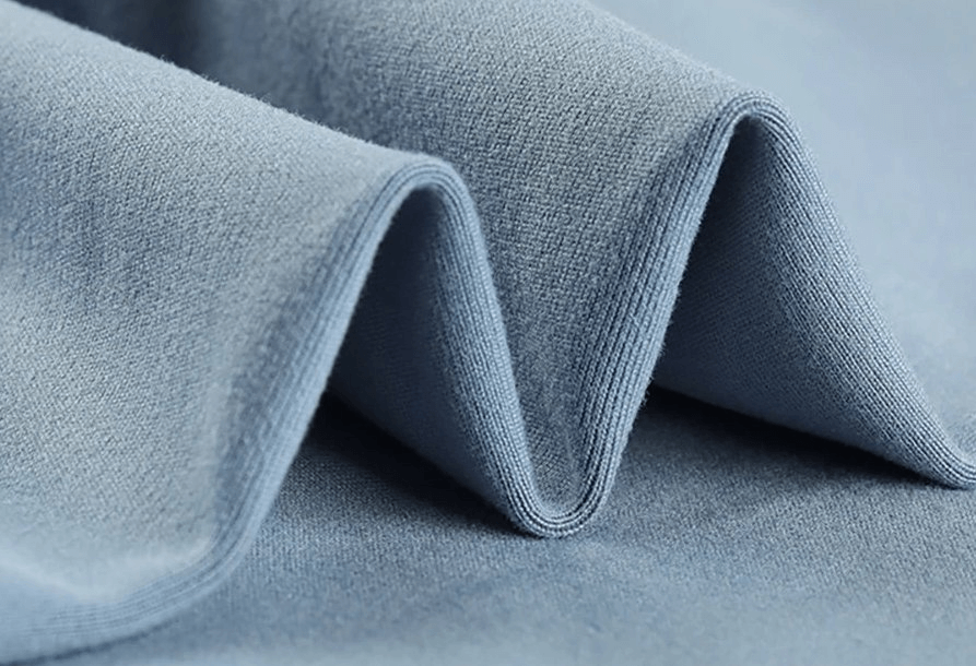 Close-up of blue polyester and spandex fabric for Sporty Elastic Women's Short Shorts.